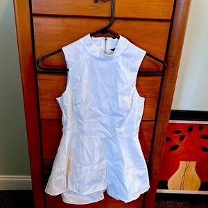 Women’s size 0P White House Black Market sleeveless top with ruffle accent